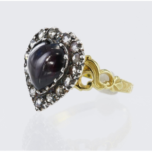 30 - Yellow gold (tests 15ct) heart shaped cluster set with one cabochon heart shaped garnet measuring 10... 