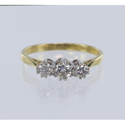 32 - Yellow gold (tests 18ct) trilogy ring, set with three graduating round brilliant cut diamonds, total... 