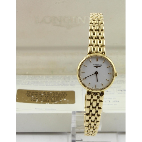 348 - Ladies 18ct cased Longines quartz wristwatch, Ref L7 471 6. The white dial with gilt baton markers. ... 