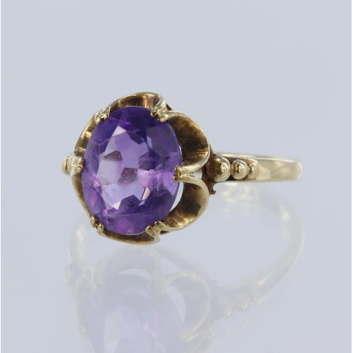 48 - 9ct yellow gold amethyst solitaire ring, oval mix cut amethyst measures 10mm x 8mm, set in six doubl... 