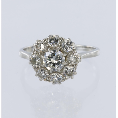 53 - White metal stamped 'PLAT' diamond daisy cluster ring, principle round brilliant cut diamond weight ... 