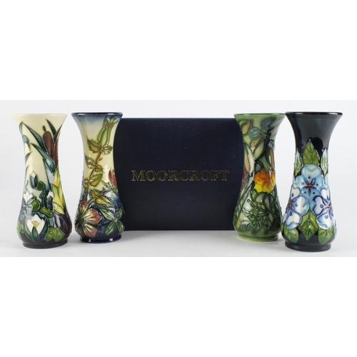 605 - Four Moorcroft vases; 'Sweet Briar', 'Lamia', 'Iris' & 'Tudor Rose' in a Moorcroft box. All 1st qual... 