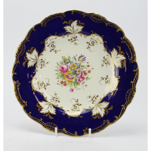 628 - Mintons. Hand painted floral cabinet plate by B Smith. Designed with a central spray of roses and ot... 