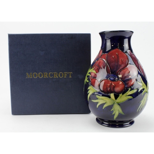 631 - Moorcroft 'Anemone' colbalt blue vase signed WM to base. Boxed. 1st quality. Height 18cm approx.