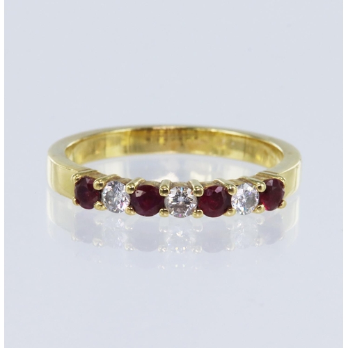 8 - 18ct yellow gold diamond and ruby seven stone eternity ring, set with three round brilliant cut diam... 