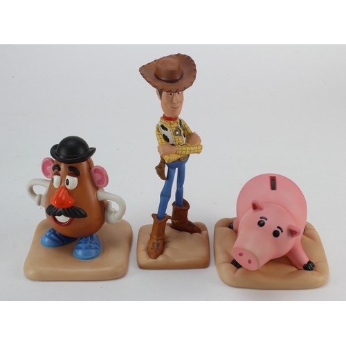 660 - Toy Story interest. A group of three boxed Toy Story figures by Walt Disney Classics Collection, com... 