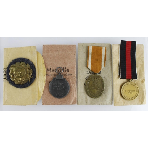 162 - German Nazi medals / badges all with paper packets, incl Drivers Proficiency Badge in bronze. Russia... 