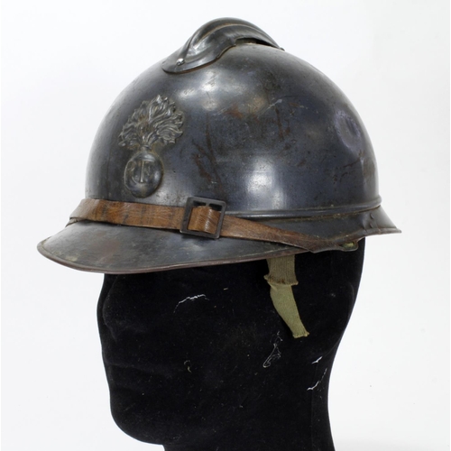 529 - WWI French Adrian helmet and badge. Liner added for display.