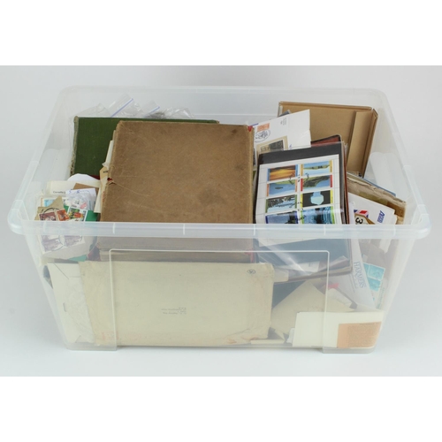 1051 - Large clear plastic crate packed with a very mixed range of stamps loose, in packets, old albums, FD... 