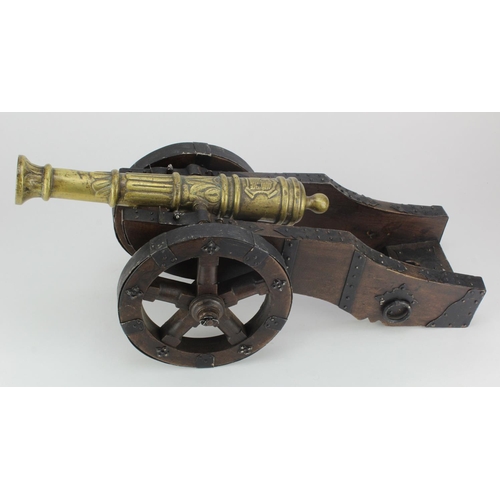 1334 - Cannon with wooden carriage with brass barrel. Total length 24