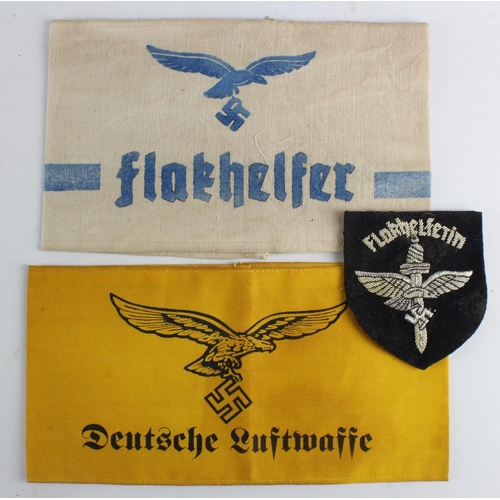 1740 - German Luftwaffe Flak Helper armband and badge and another armband.