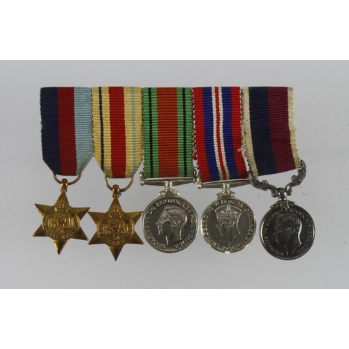 2356 - RAF attributed miniature group of five with full set of copy service papers to Squadron Leader A C M... 