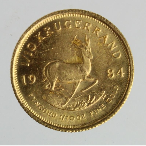 251 - South Africa gold 1/10th Krugerrand 1984 EF, spot of adhesive rev.