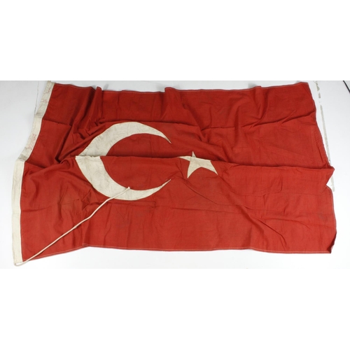 2532 - WW1 Turkish flag 3x5 feet with various stencilling to the lanyard.