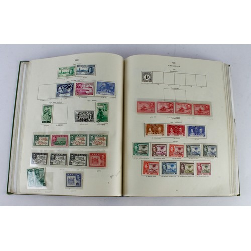 1045 - KGVI Stamp Album (green) by Stanley Gibbons, well filled with approx 3000+ stamps, several full sets... 