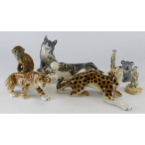 195 - Animal interest. A group of eight various animal figures, including meerkats, monkey, koala, cats, e... 