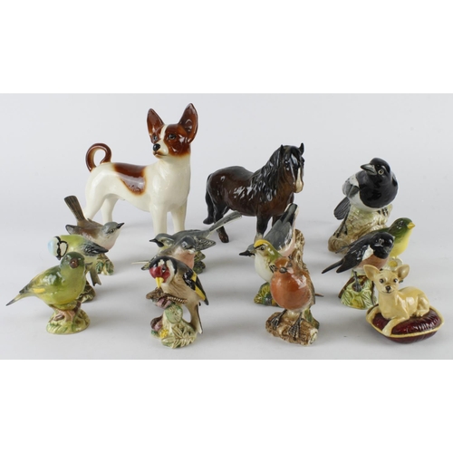 204 - Beswick. A group of fifteen mostly Beswick figures, including various birds, dogs & a horse, tallest... 