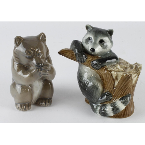 257 - Royal Copenhagen. Two Royal Copenhagen porcelain figures, depicting a bear (no. 3014) & a raccoon (n... 