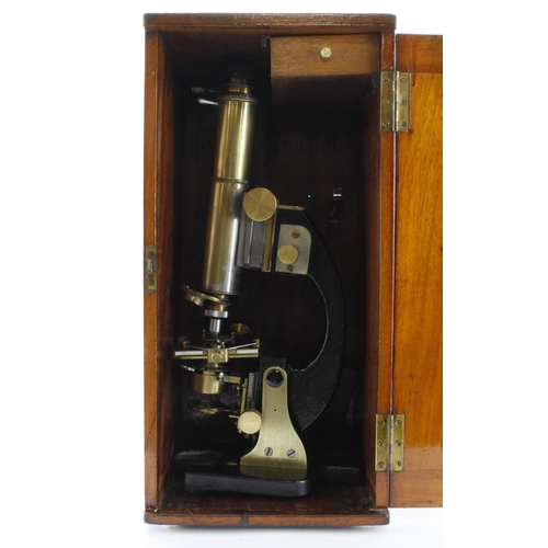 422 - Microscope. Large brass & black lacquered microscope, height 41cm approx. contained in a contemporar... 