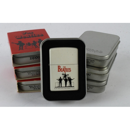 522 - Zippo. A group of seven cased Beatles themed Zippo lighters