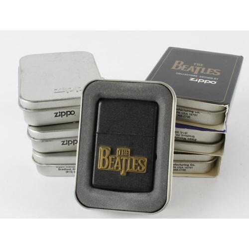 525 - Zippo. A group of seven cased Beatles themed Zippo lighters