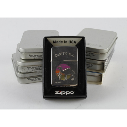 526 - Zippo. A group of seven cased Zippo lighters, including Beatles, Rolling Stone, John Wayne, Titanic,... 