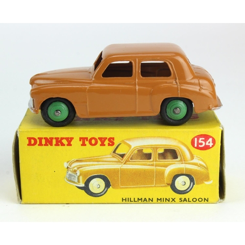 85 - Dinky Toys, no. 154 'Hillman Minx Saloon', dark tan with mid green hubcaps, contained in original bo... 