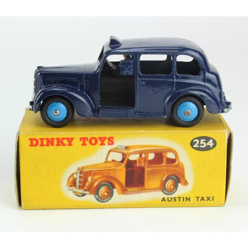 93 - Dinky Toys, no. 254 'Austin Taxi', dark blue with light blue hubcaps, contained in original box (sca... 