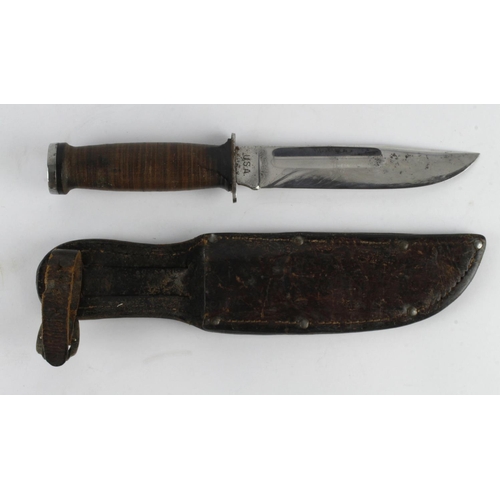 1235 - WW2 Fighting knife with leather scabbard. Blade maker marked 'U.S.A. Robeson SpurEdge'.  