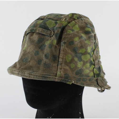 1279 - German Camo helmet cover, service worn.