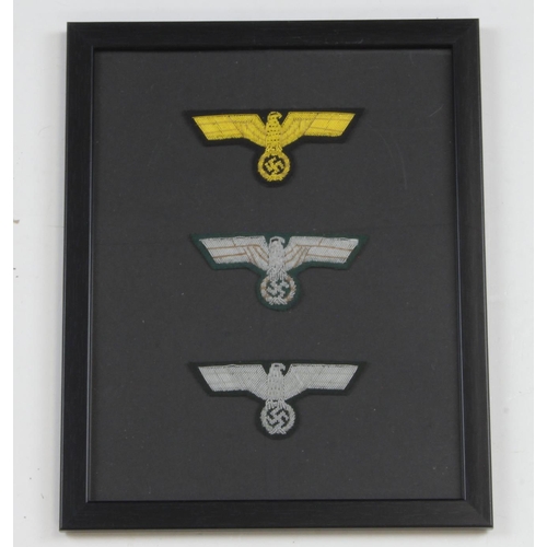 1292 - German framed collection of officers breast eagles.