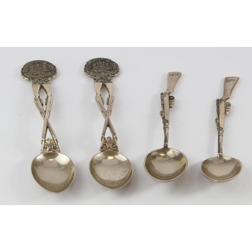 1009 - Teaspoons. Four novelty silver Military interest teaspoons, each having rifle handles (two marked Gi... 