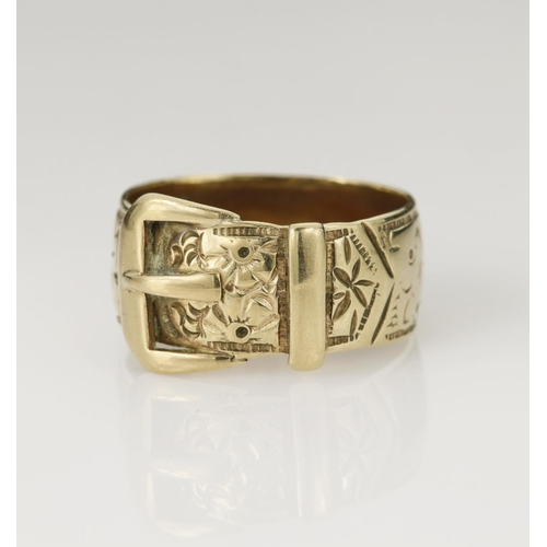 127 - 9ct yellow gold buckle ring, engraved with floral details, width 9mm, finger size T/U, weight 7.4g.