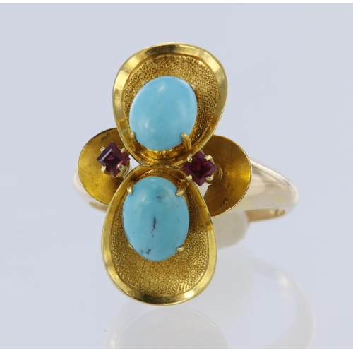 129 - Yellow metal (tests 14ct) turquoise and ruby dress ring, two oval cabochon cut turquoise measuring 8... 