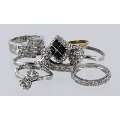 375 - Assortment of CZ dress rings all 9ct/tests 9ct. Finger size ranges from M-Q. Total weight 21g.