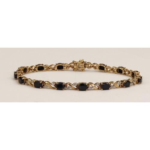 377 - 9ct yellow gold sapphire and diamond line bracelet, fifteen oval sapphires each measuring approx 5mm... 