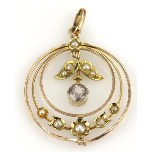 380 - Yellow gold (tests 9ct) vintage pendant set with amethyst and seed pearls, floral and foliate desing... 