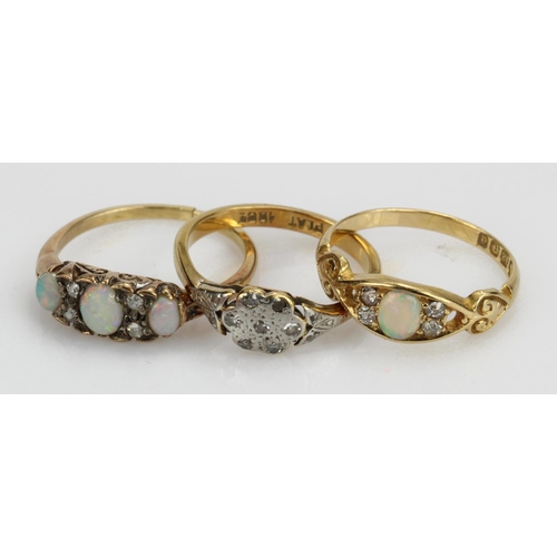 382 - Three 18ct/tests 18ct yellow gold rings, stones include opal and diamonds, all with some damage, tot... 