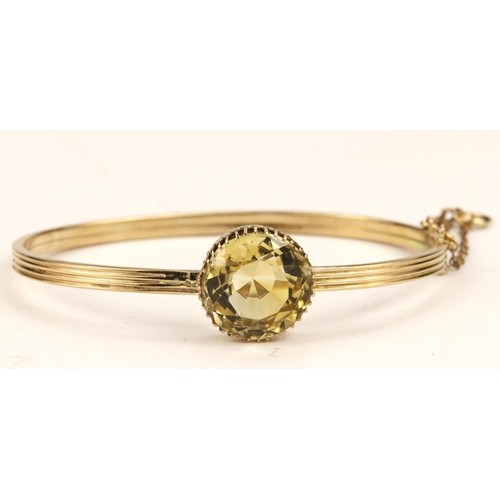 383 - Yellow gold (tests 9ct) antique citrine bangle, one round mix cut citrine measuring approx 14mm, cla... 