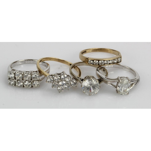 390 - Five 9ct gold/tests 9ct CZ dress rings, total weight 13.8g.