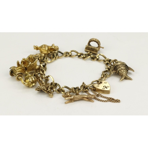 590 - 9ct yellow gold heart padlock bracelet with 9ct gold/ tests 9ct charms, safety chain included, total... 