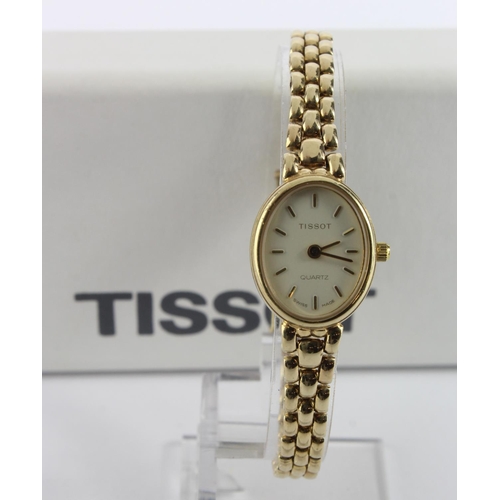 669 - Ladies 9ct cased Tissot quartz wristwatch. On an 9ct bracelet. Total weight 18.1g. Boxed with some p... 