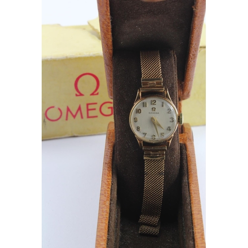 720 - Ladies 9ct cased Omega manual wind wristwatch on a 9ct bracelet. Circa 1954. Presentationally engrav... 