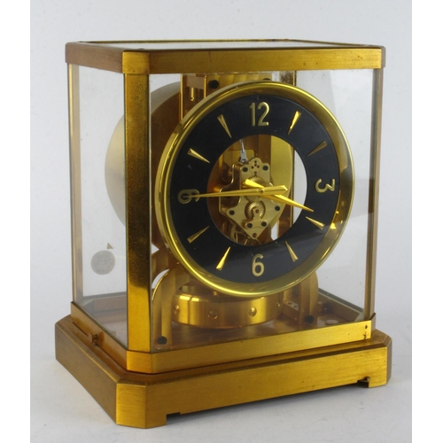 830 - Jaeger LeCoultre Atmos clock, gilt metal with five glass panes, Arabic numerals to black dial, heigh... 