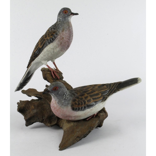 871 - Mike Wood. A carved wood sculpture by Mike wood, titled to base 'Turtle Doves' (12/2001), depicting ... 