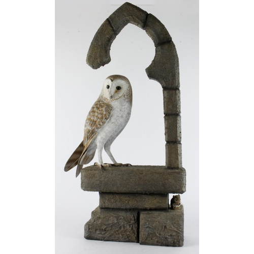 872 - Mike Wood. A large carved wood sculpture by Mike wood, titled to base 'Barn Owl' (1/2000), depicting... 