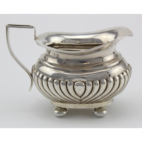 904 - Small silver Queen Anne style cream jug on four ball feet weighs 3oz approx.