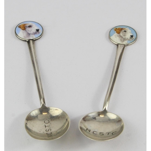 916 - Teaspoons. Two novelty silver & enamel teaspoons, both depicting dogs heads (terriers), hallmarked '... 