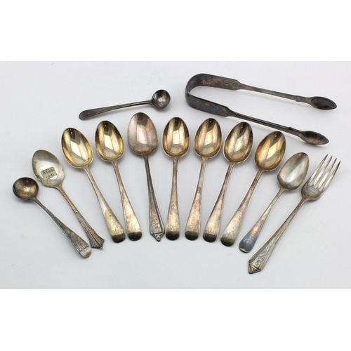 953 - Silver. A collection of various silver spoons, sugar tongs, etc. silver weight 7.8 oz. approx.