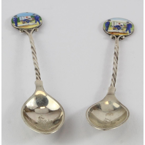 979 - Teaspoons. Two novelty silver & enamel Military teaspoons, both depicting Military ambulance scenes,... 